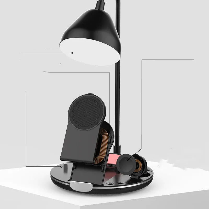 Black folding wireless charger showing magnetic phone attachment and built-in cable storage compartment