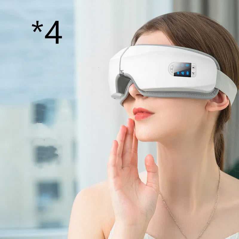 White USB eye massager with PU eye mask, 180-degree folding design, LCD screen and Bluetooth music.