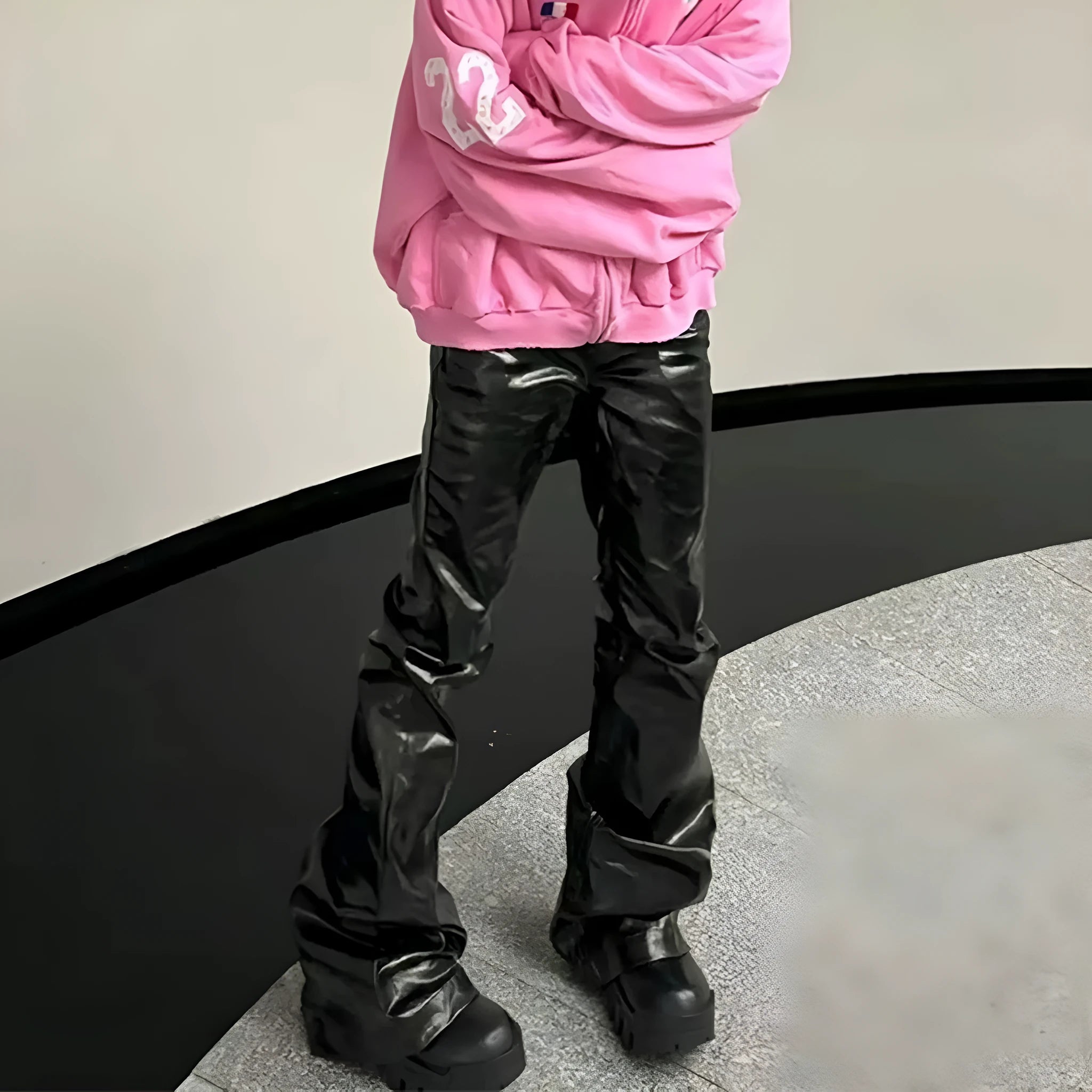 Black shiny patent leather skinny jeans with straight leg design and mid waist