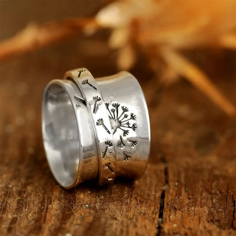 Silver rotatable flower ring in European American style with five size options displayed