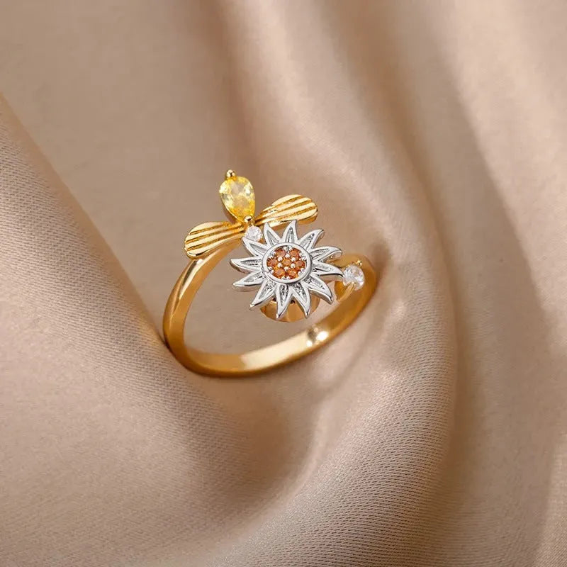 Gold and platinum electroplated copper decompression ring with rotatable design and adjustable opening