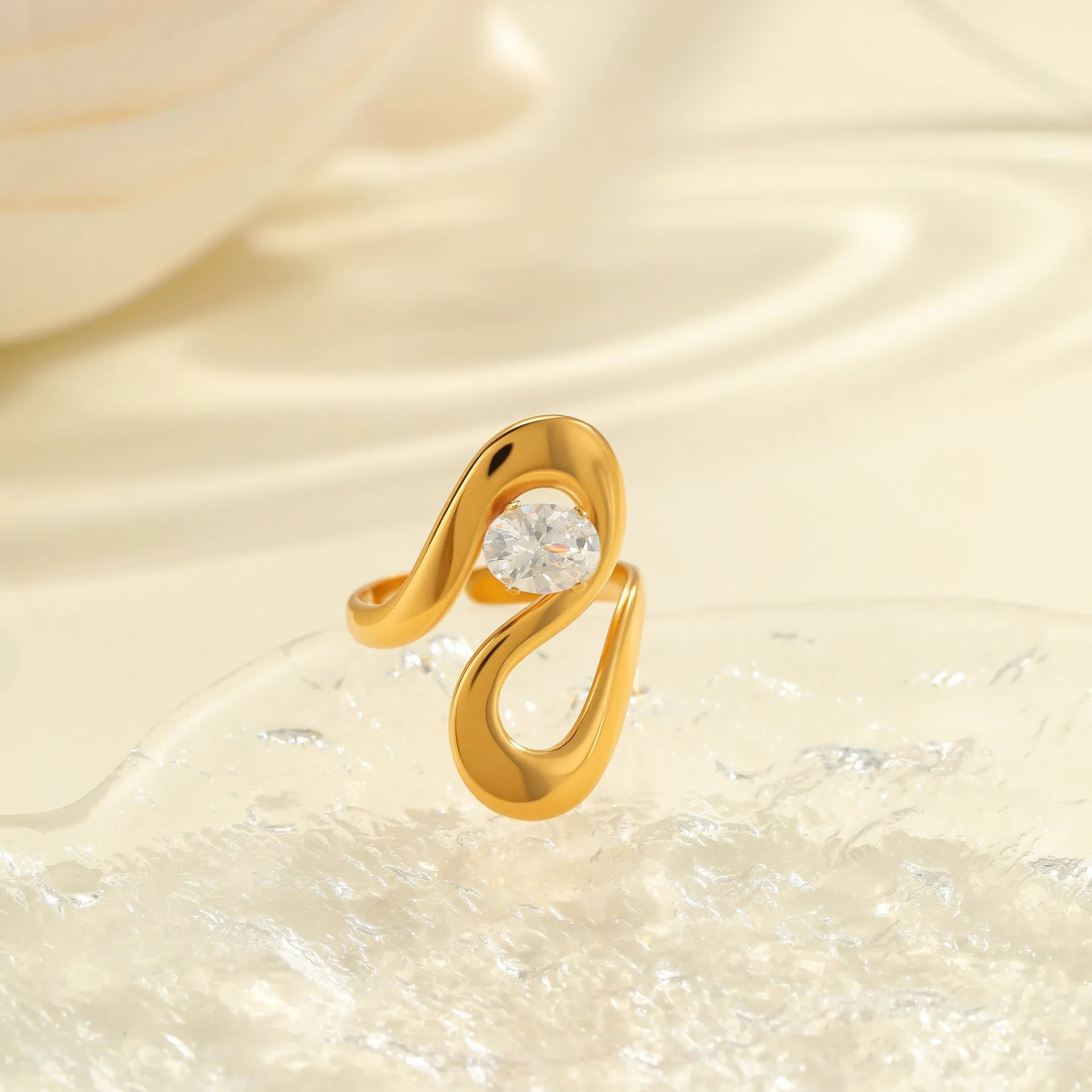 Geometric zircon ring with stainless steel construction and open mouth design in electroplated finish