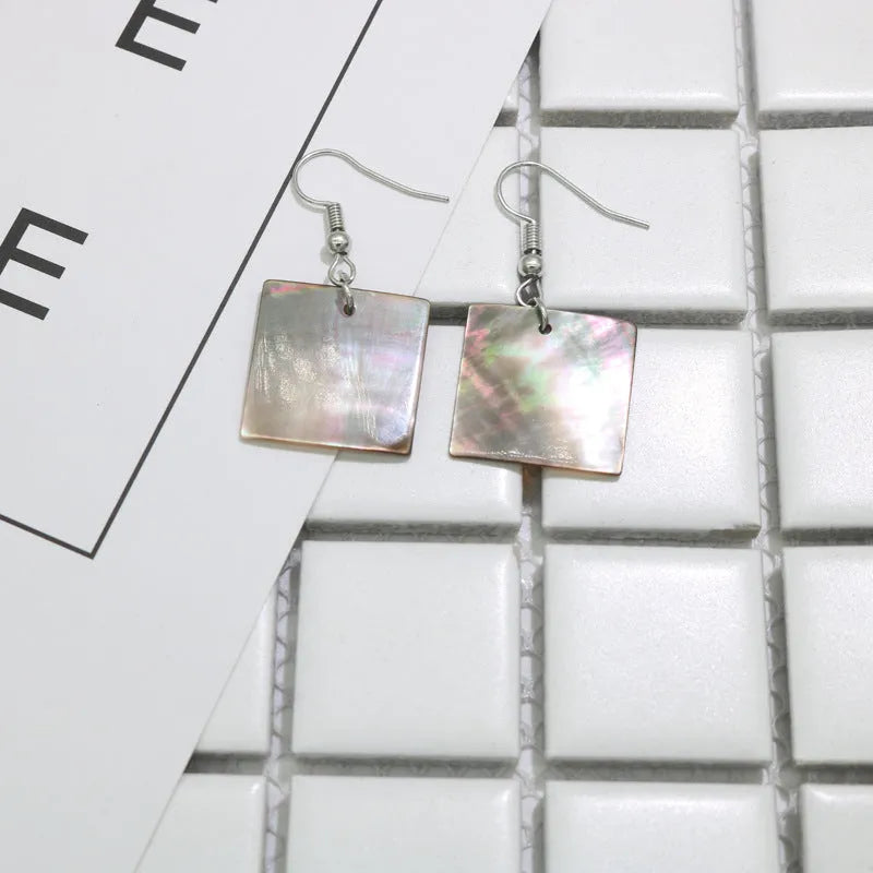 Women's geometric shell earrings in square or rectangular designs with natural patterning