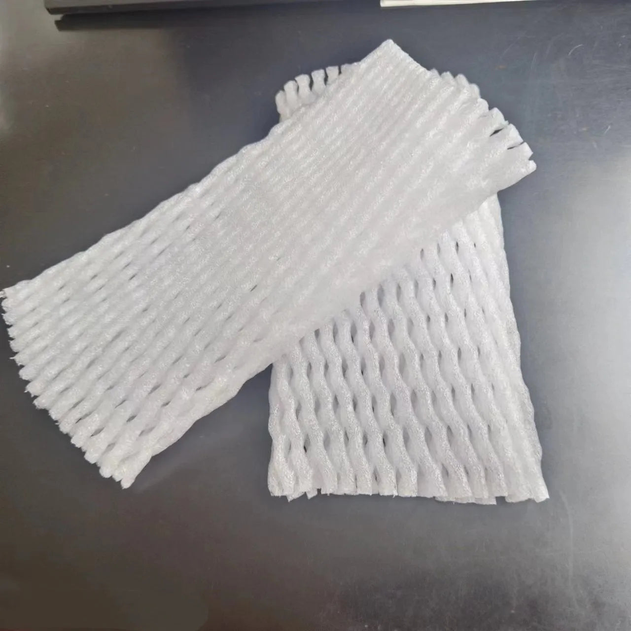 White foam fruit net cover shown with size options for shockproof fruit protection