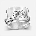 Silver rotatable flower ring in European American style with five size options displayed