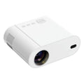 White Full HD smart projector with remote control on a wooden surface.