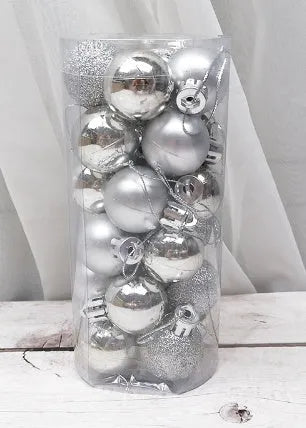 Assorted gold, red, silver and blue 3cm diameter shiny matte Christmas baubles displayed together.
