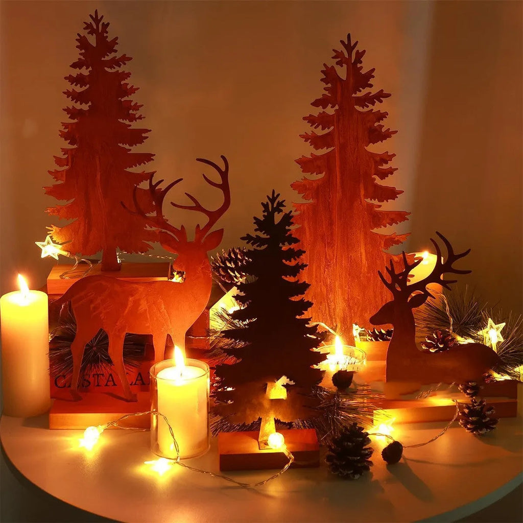 Three rustic metal Christmas tree ornaments shaped like elk with an oxidised iron finish.