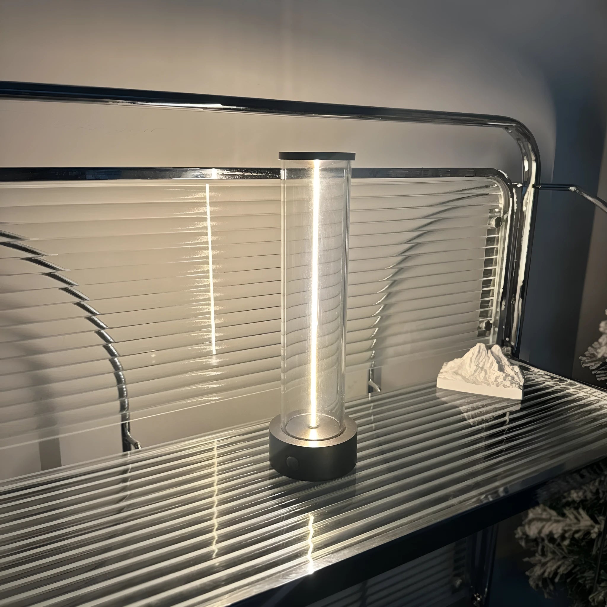 Slender LED glass light strip with magnetic mounting and USB charging cable