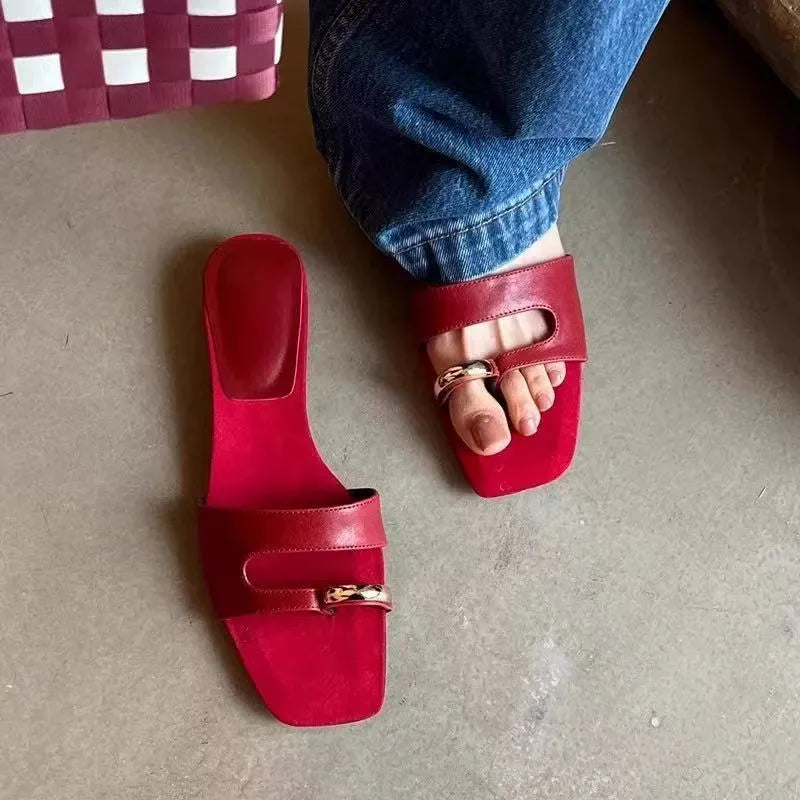 Square toe leather outdoor slipper in multiple colours on a plain background.