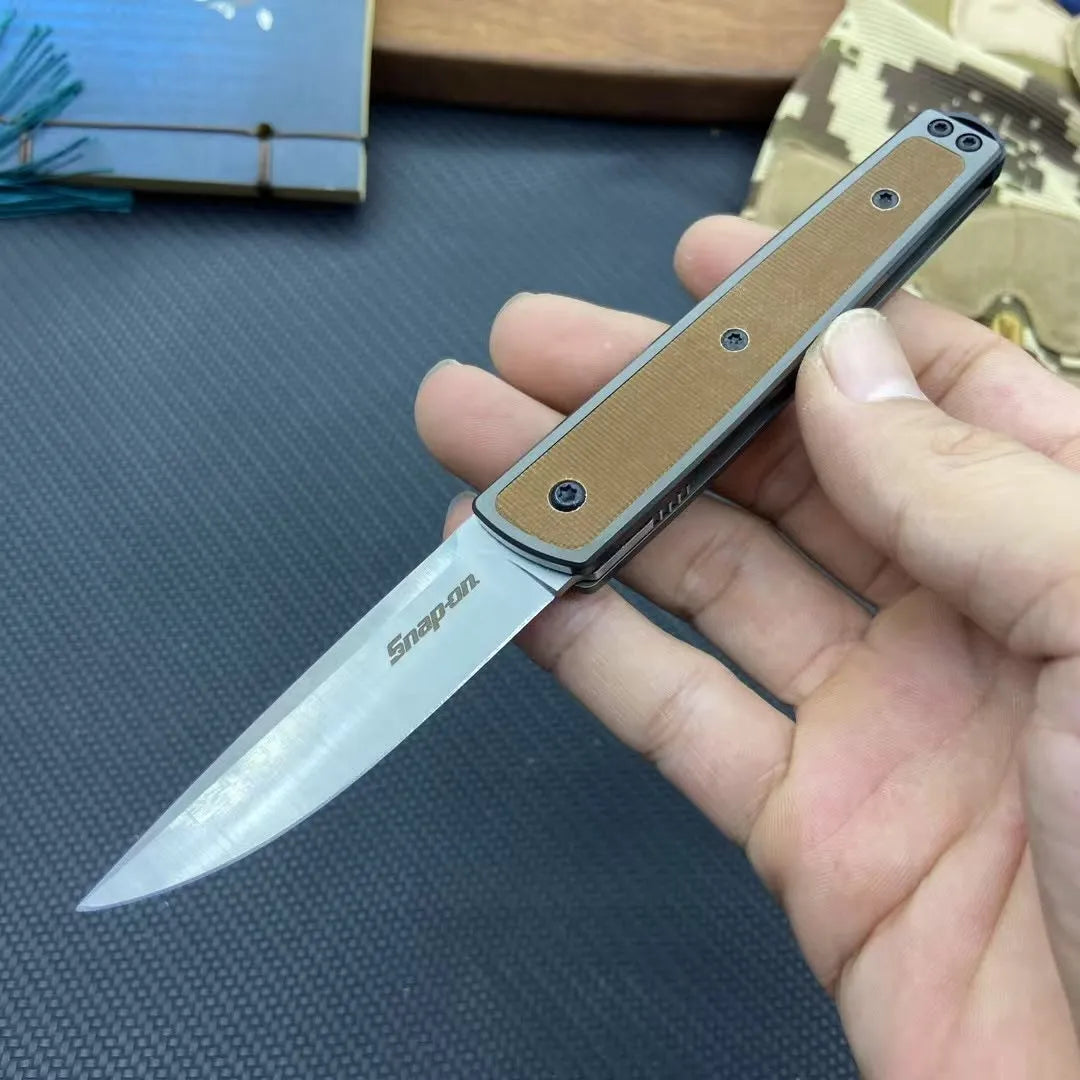 CRKT 7190 folding fruit knife showing blade and handle with colour options of black, brown, and red