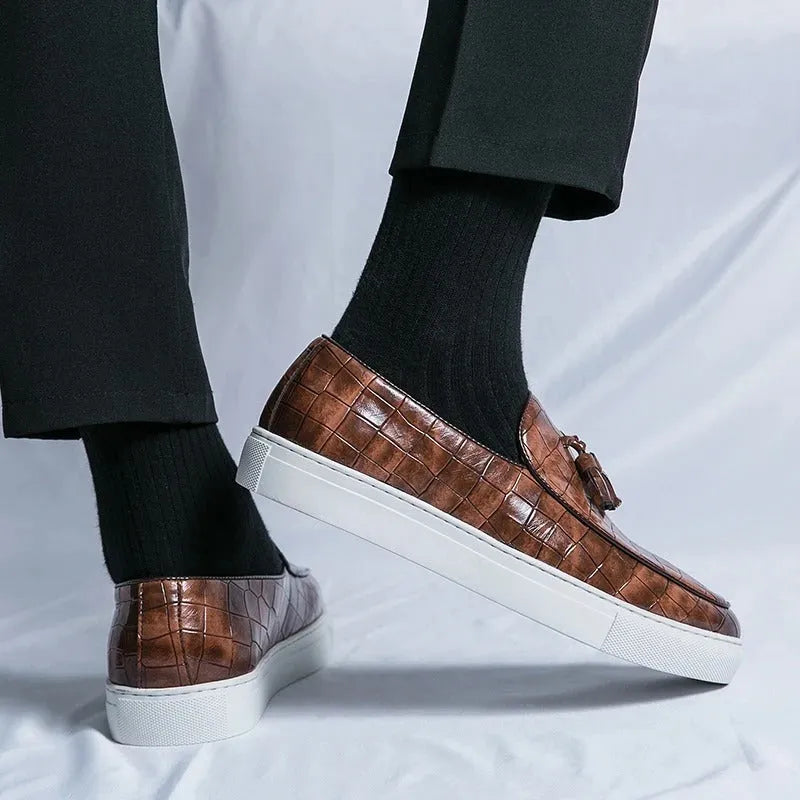 Men's black plus size casual sneakers with tassel detail on artificial PU upper and round toe.