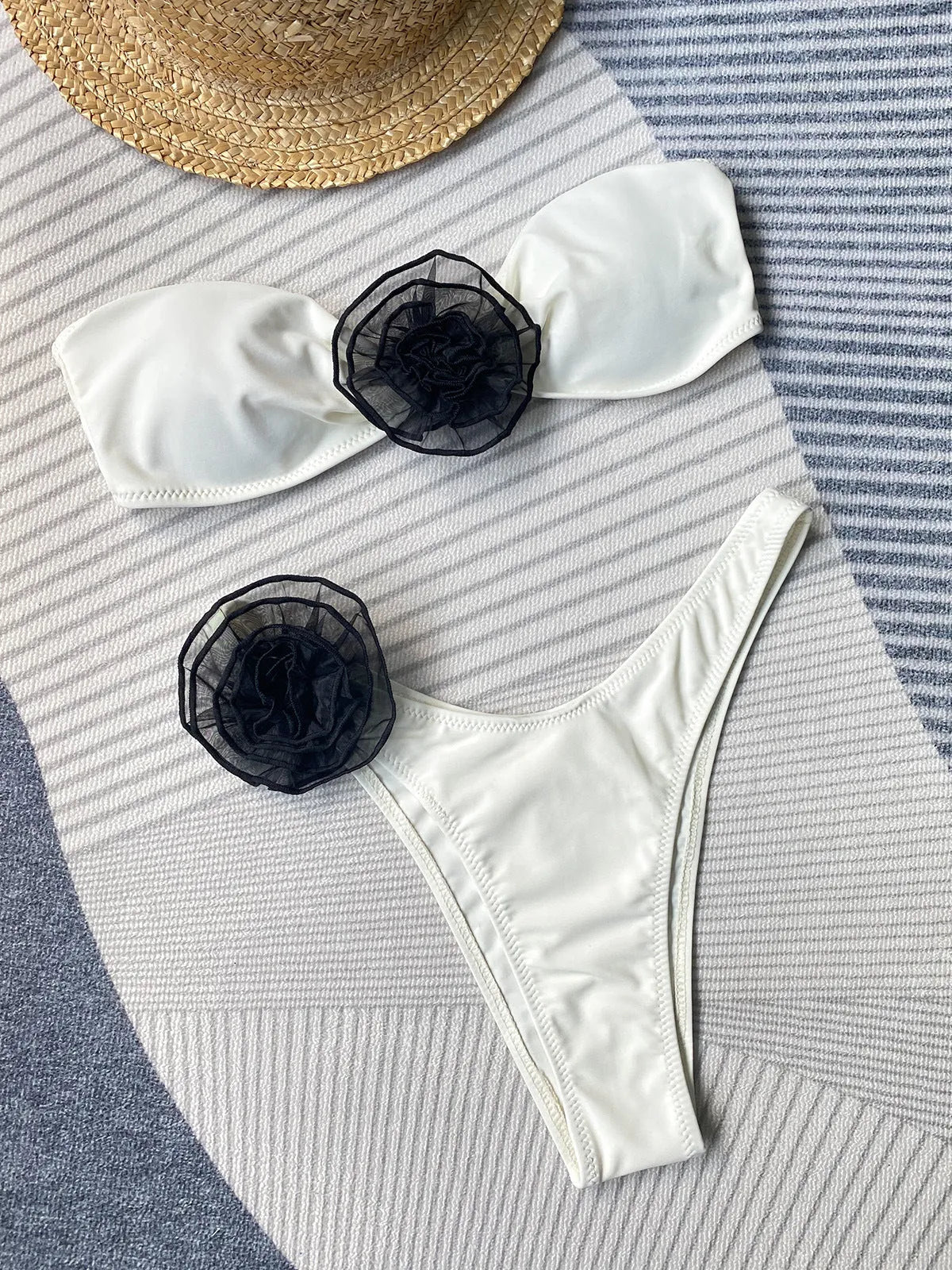 Black cross-back tube top bikini with floral split detail on the shorts.