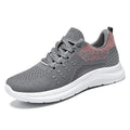 Women's low-top mesh sneakers with lace-up front and soft PVC sole in black, grey, or pink