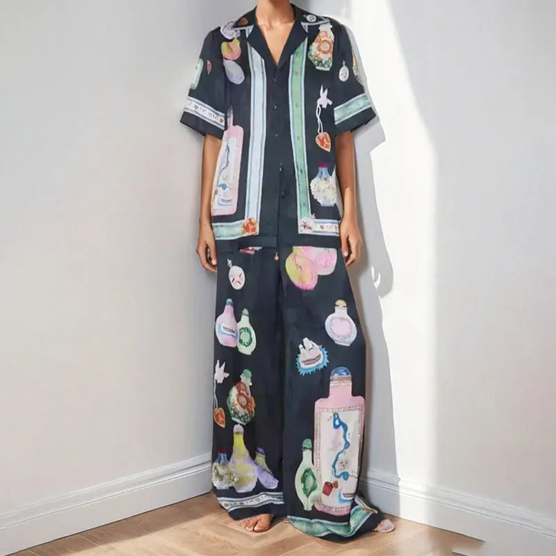 Black two-piece cardigan and pants set with cartoon animation pattern for women