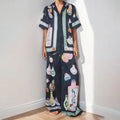 Black two-piece cardigan and pants set with cartoon animation pattern for women