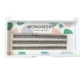 Black V-shaped fairy fishtail false eyelashes with thick segments in varying lengths on a clear tray.