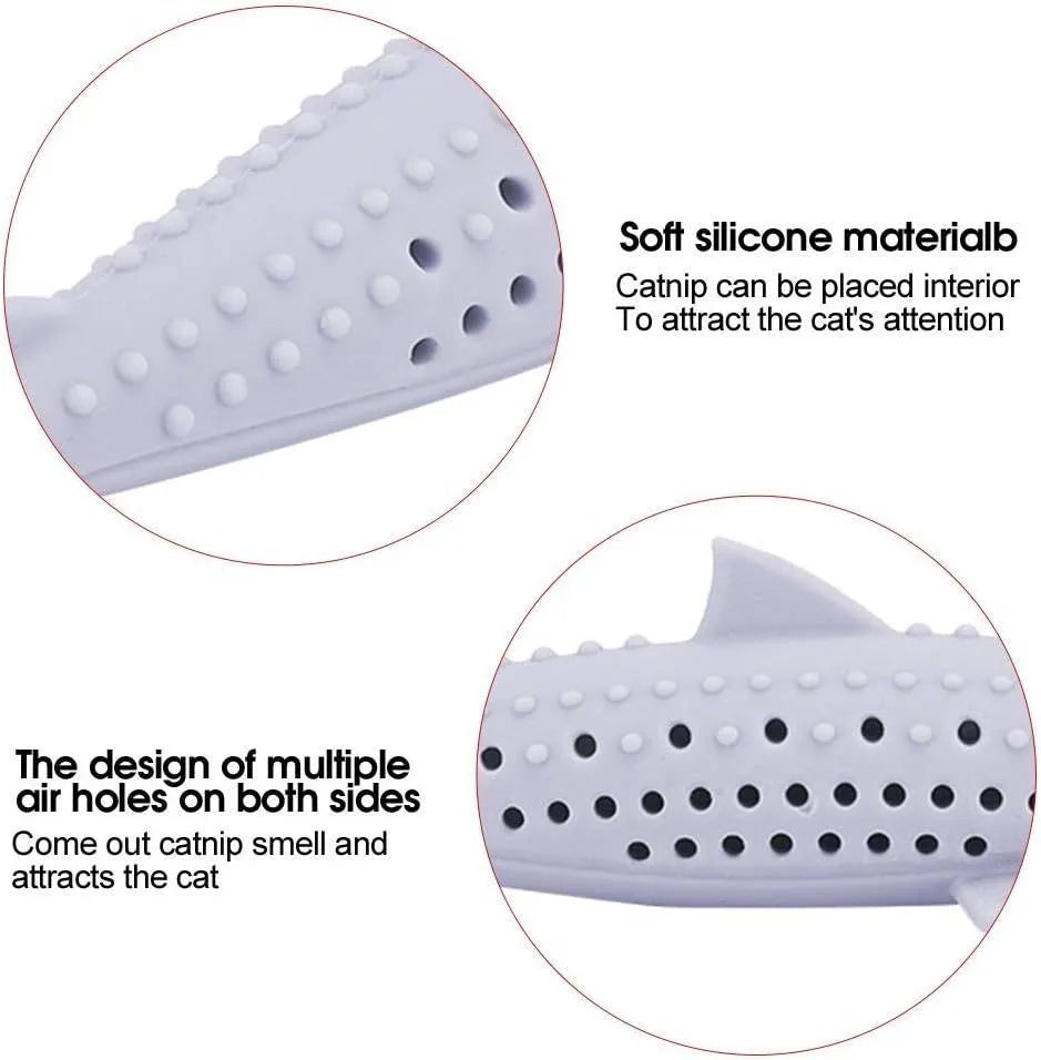 Green silicone fish-shaped cat chew toy with dental cleaning texture and side holes