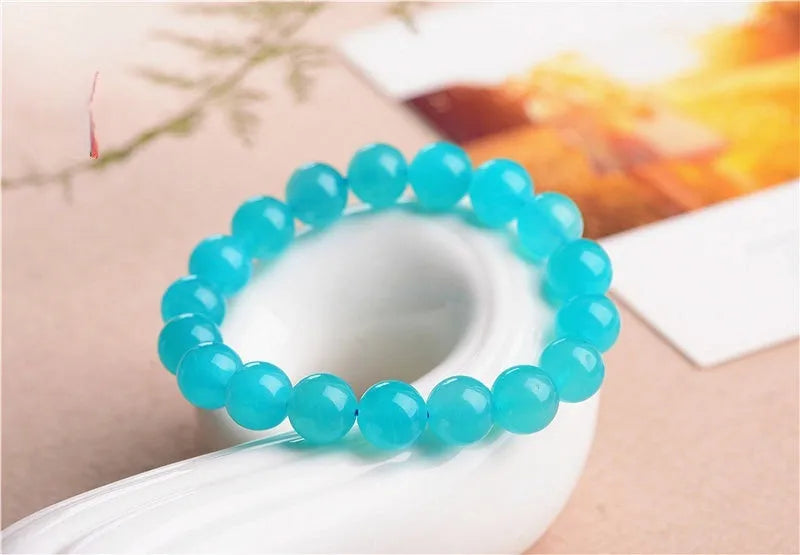 Grade 7A Amazonite natural gemstone scattered beads showing blue-green ice colouration and polished surface