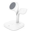 Black and white wireless charging stand for phone, watch, and headphones on a desk.