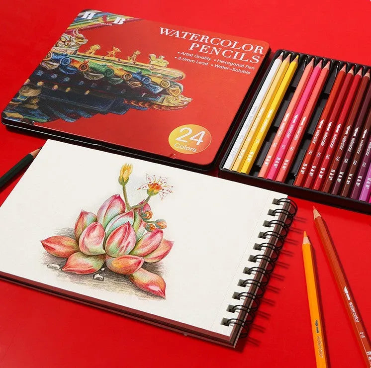 Metal tin open to show 24 water-soluble coloured pencils and a brush for painting techniques.