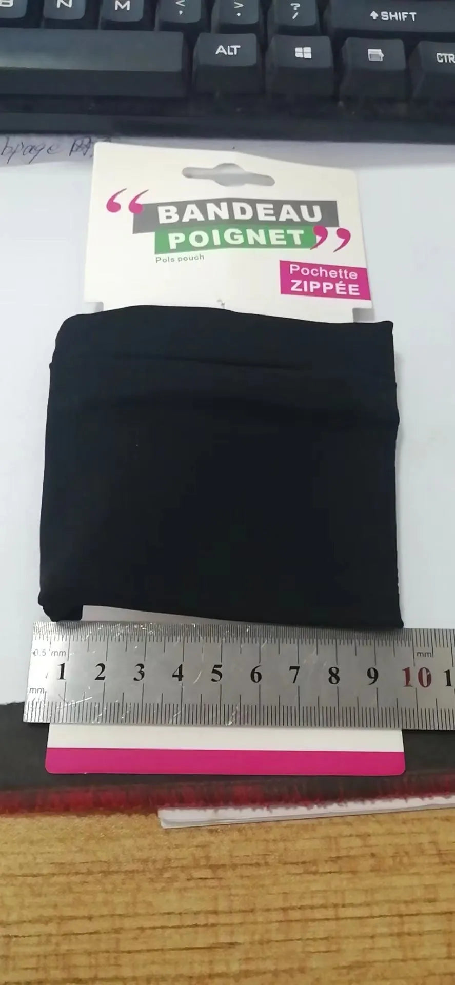 Compact 10x10.5cm wrist bag armband sleeve for mobile phones, shown with cardboard packaging for camping and fitness use.