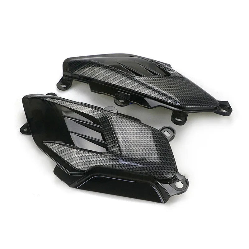 Pair of carbon fibre style LED side lamps for Yamaha NMAX scooter on a white background.
