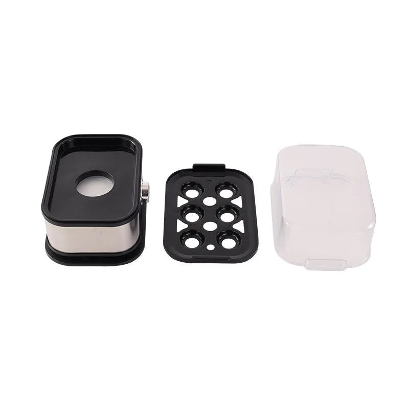 Black stainless steel portable egg boiler with a carry belt.