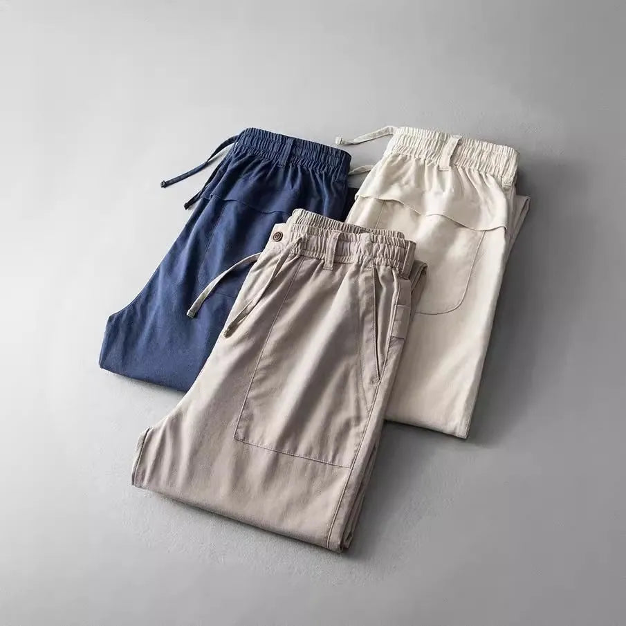 Men's linen casual trousers in solid colour with mid waist design and traditional trouser length