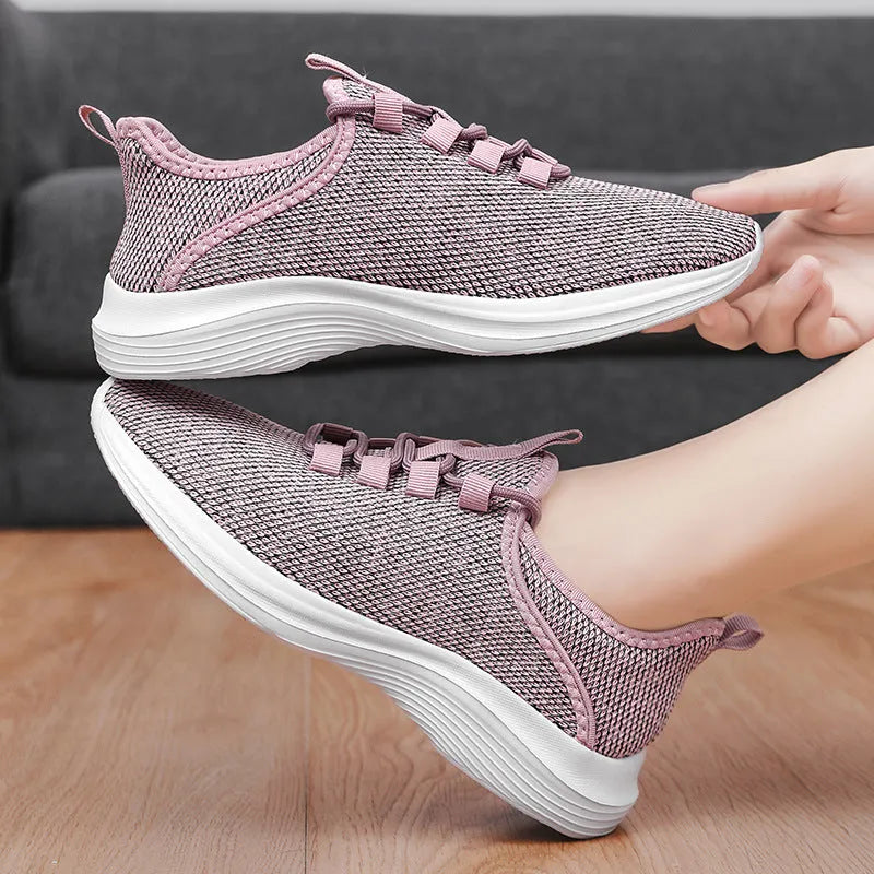 Women's breathable mesh casual sneaker in black with round toe and lace-up front