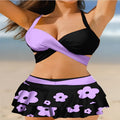 Women's purple bikini swimsuit with matching skirt featuring high waist briefs and lace-up design