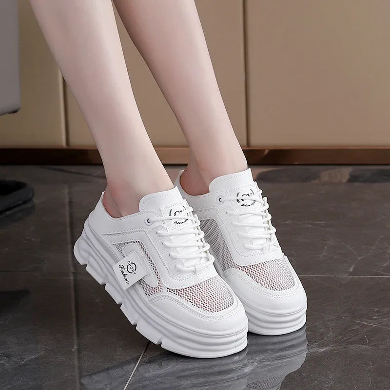 Women's black mesh half slippers with round toe and rubber sole on a white background.