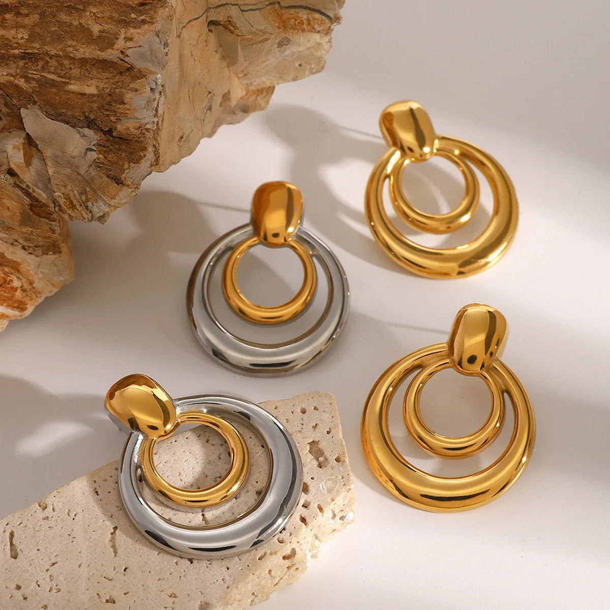 Golden round double-layer hollow stud earrings with geometric design on titanium steel