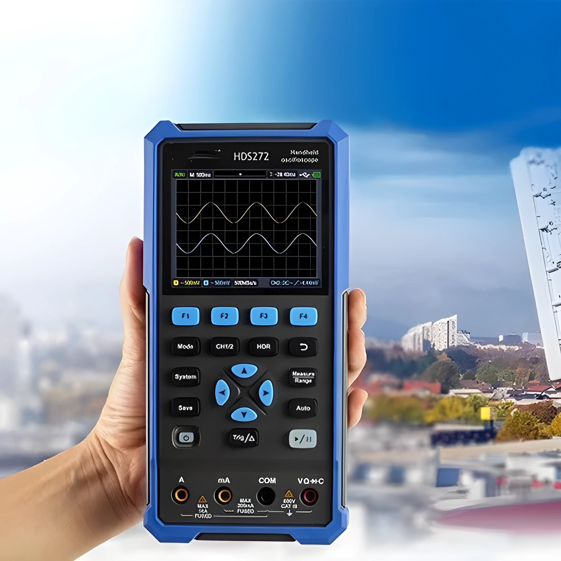 Owon HDS272 handheld digital oscilloscope with probe and accessories on a workbench