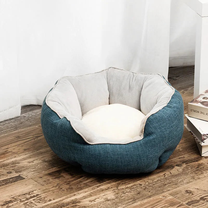 Blue octagonal pet bed with soft wool point design and removable mat for a small dog.