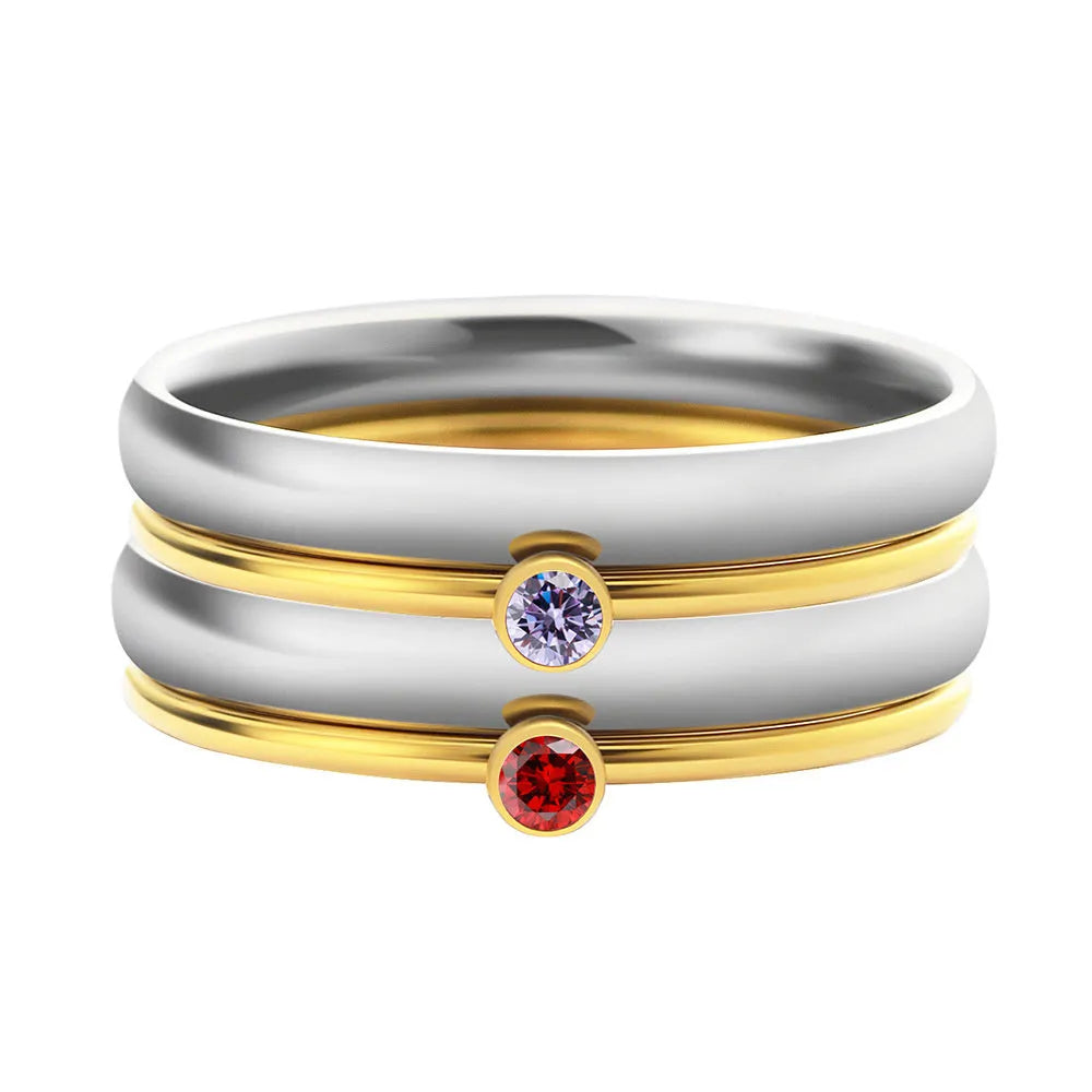 Close-up of a titanium steel engraved ring in a geometry shape, styled for the December birthstone colour.