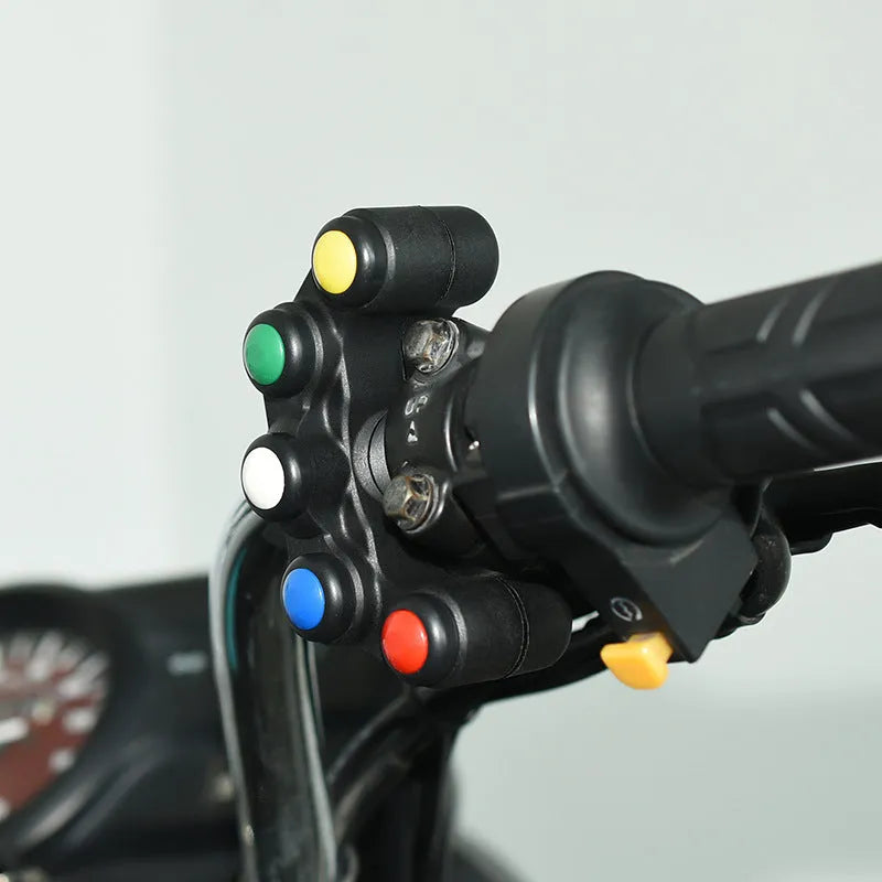 Plastic five-position toggle switch with coloured buttons for motorcycle electrical accessories.