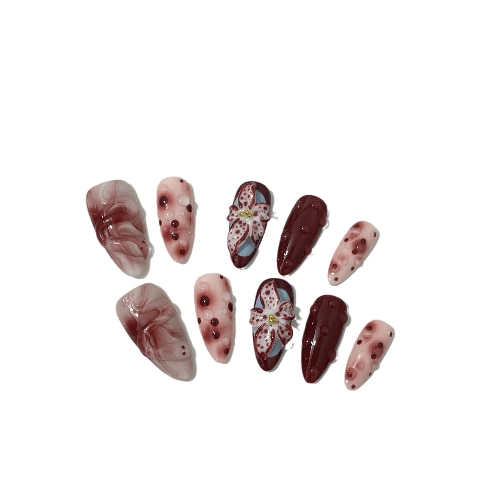 Almond colour artificial nails with 3D carved floral designs including roses and tulips