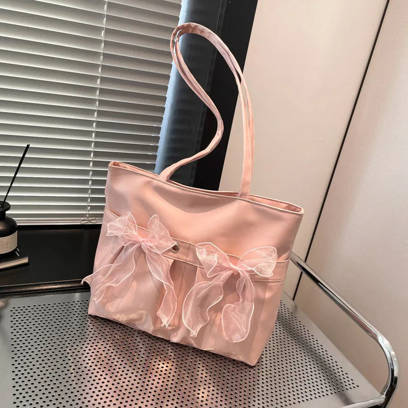 College style bow tote bag in black and pink with large capacity and internal zip compartment