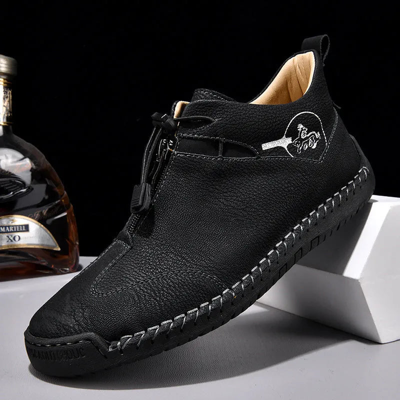 Men's black casual leather sneakers with a mid heel and round toe on a rubber sole.