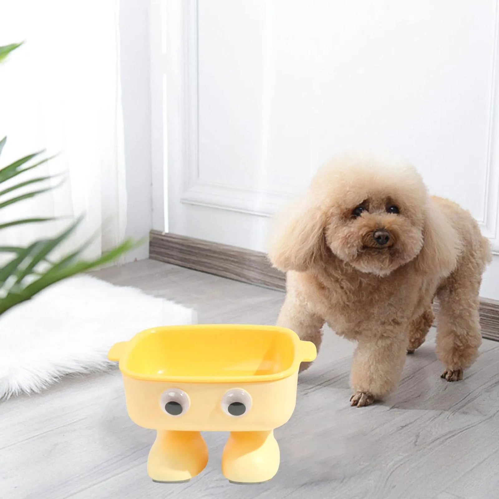 Robot-shaped elevated cat bowl with tilted feeding surface in green colour