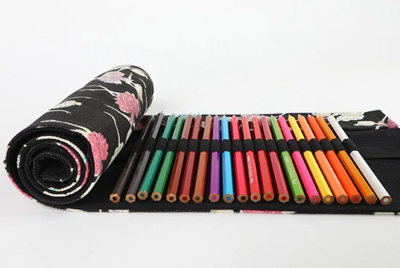 Canvas rolling pencil case with ballet girl print, showing multiple holes for pencils in a rolled-open state.