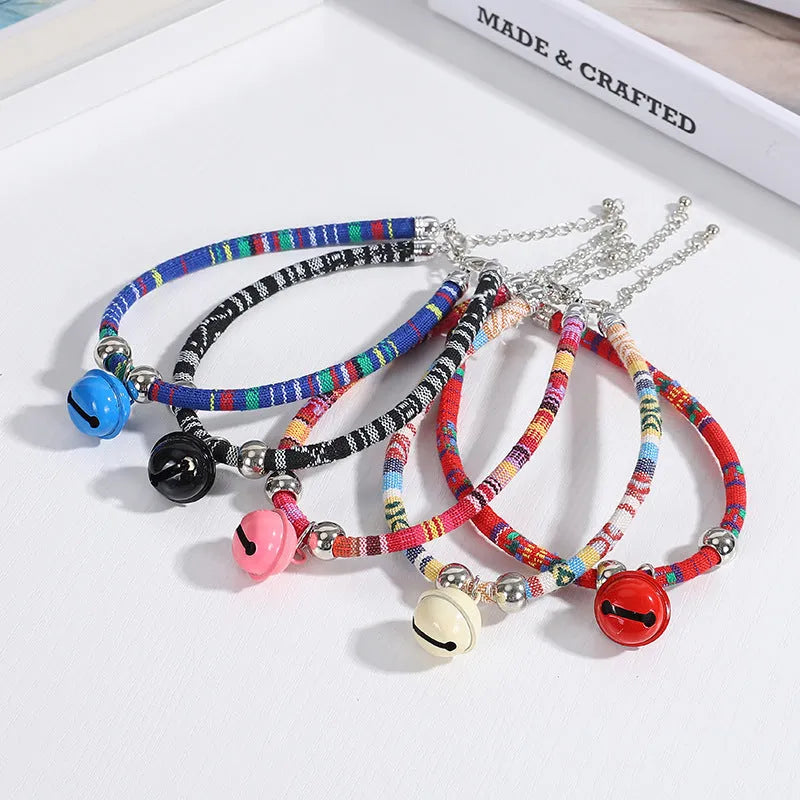 Coloured ethnic pattern adjustable pet collar with a bell for a dog or cat.