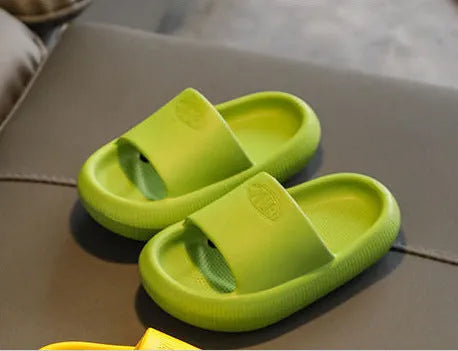 Brightly coloured children's EVA slippers with a textured non-slip sole, shown in multiple colour options.