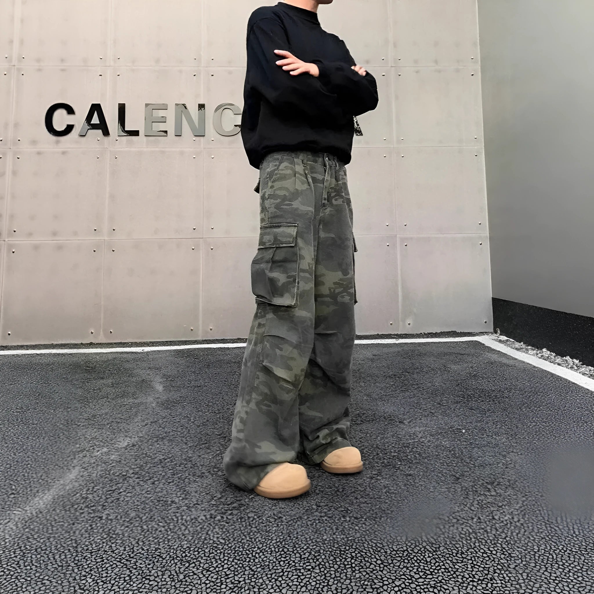 American vintage washed camouflage green cargo trousers with multiple pockets on a neutral background.