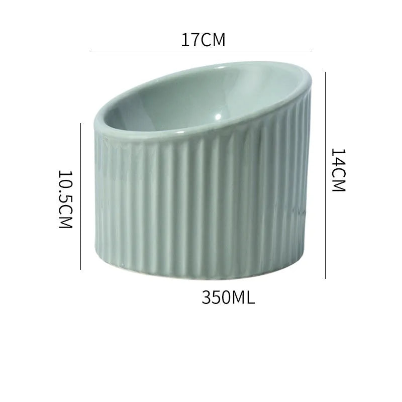 Ceramic elevated cat bowl in green colour, showing tilted design and raised feeding height.