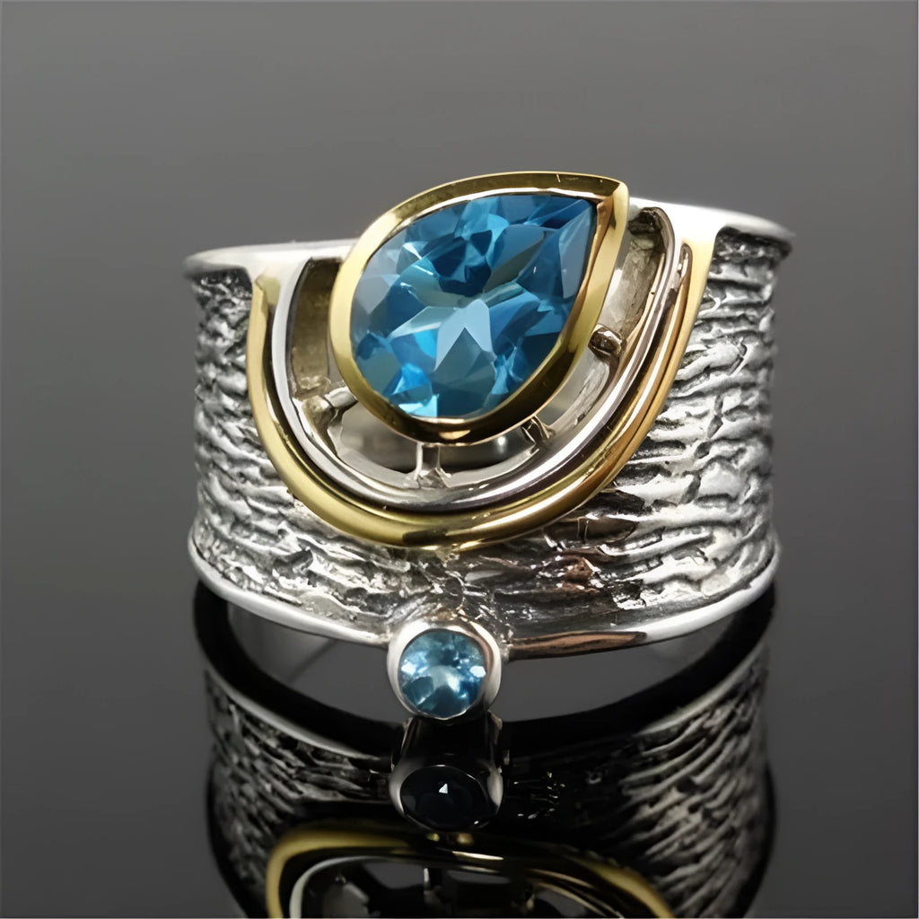 Blue zircon rhinestone ring in Chinese style with drop shape design on woman's hand