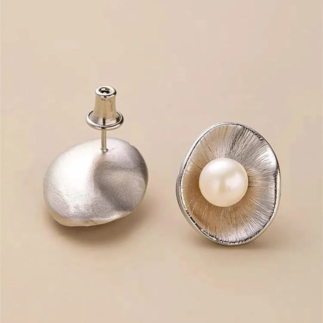 Pearl sterling silver needle earrings with geometric design and electroplated gold finish