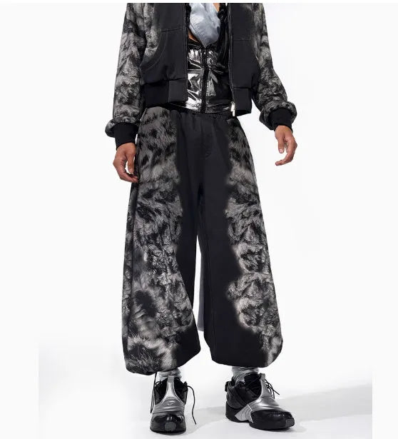 Women's loose printed polyester streetwear set showing hoodie, trousers, and seven-inch shorts.