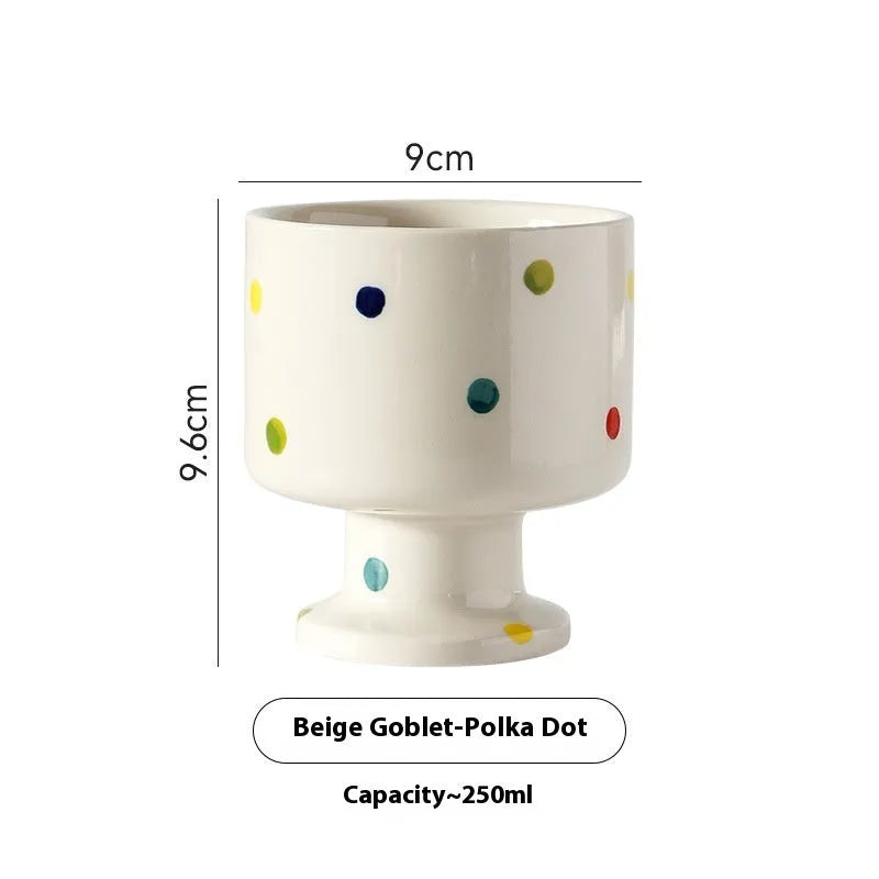 Hand-pinched irregular ceramic mug in a solid colour, shown from the side to display its unique shape.